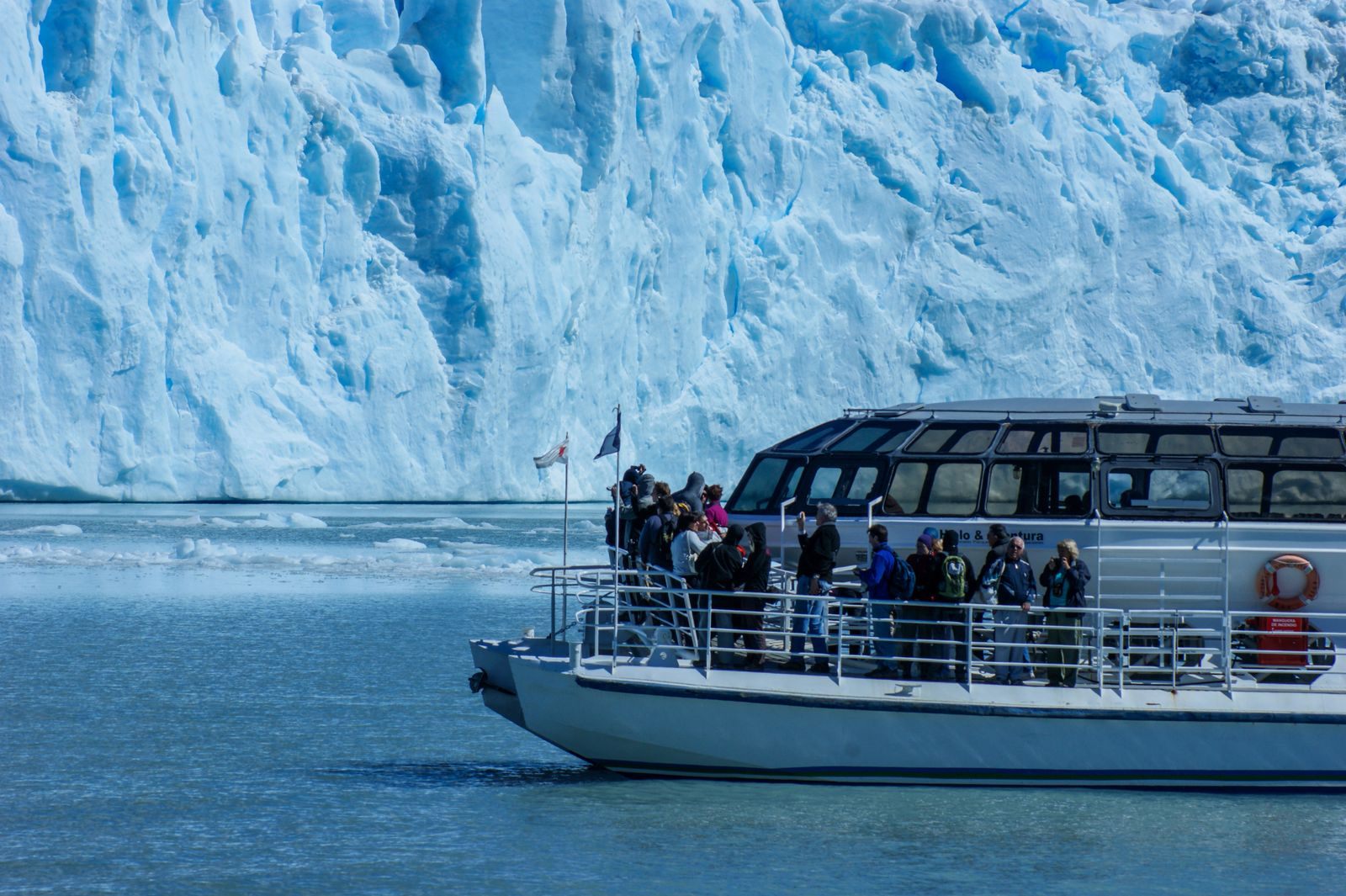 Tour boat passing a tidewater glacier in Alaska