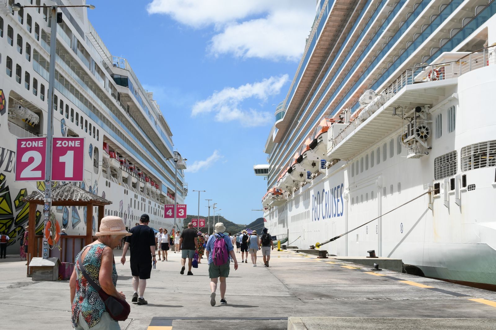 Cruise passengers walking along the pier